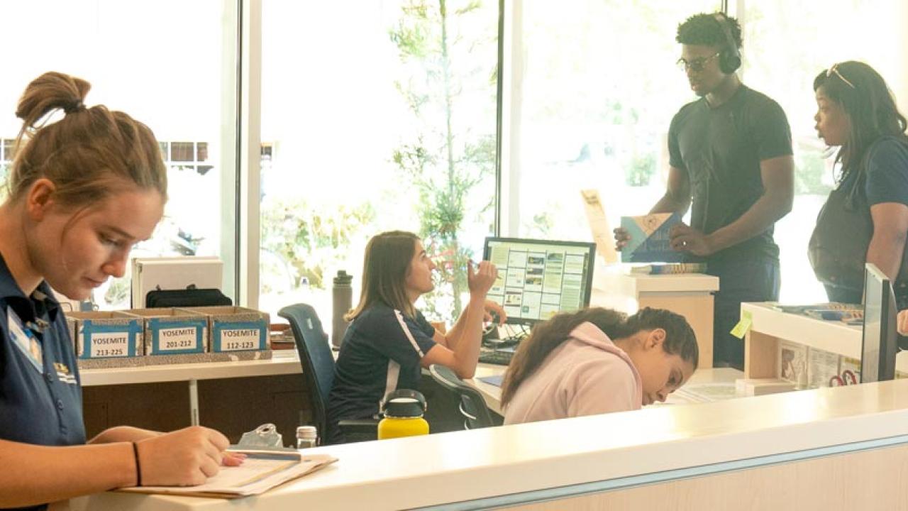 Student employees at a residence hall service desk